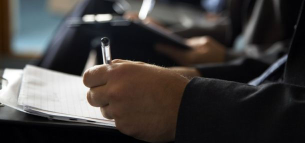 business man signing papers